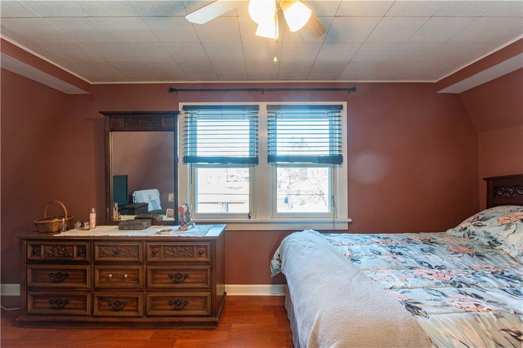 1146 Chestnut Street Monaca, PA 15061 - Photo 23 of 37 a bedroom with a bed and a large mirror on the dresser