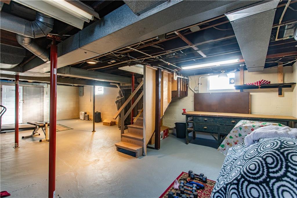 1146 Chestnut Street Monaca, PA 15061 - Photo 26 of 37 a bed room with a bed and a couch