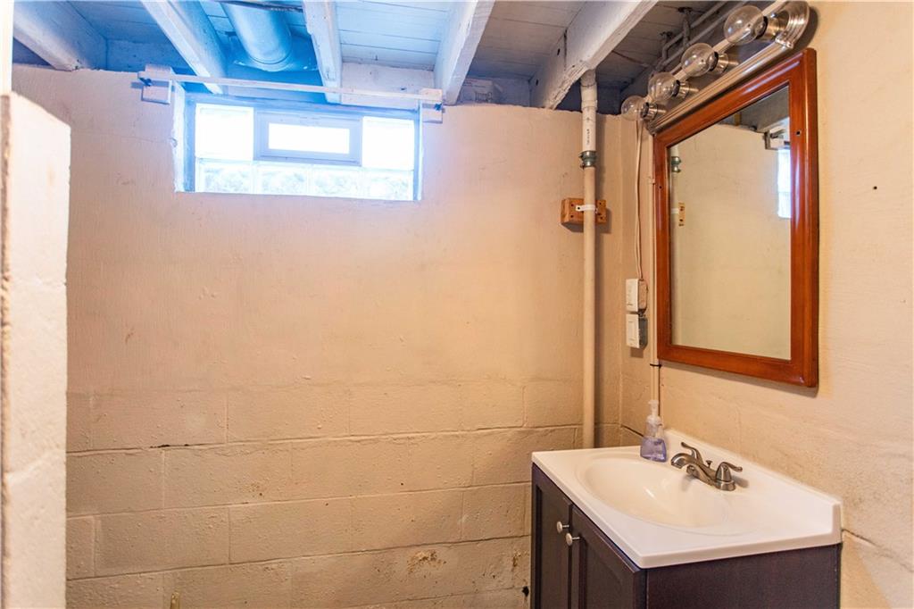 1146 Chestnut Street Monaca, PA 15061 - Photo 30 of 37 a bathroom with a sink and a mirror