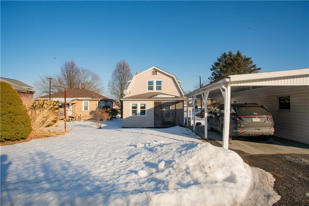 1146 Chestnut Street Monaca, PA 15061 - Photo 34 of 37 a view of a house with a snow in the background