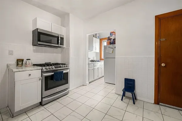 a kitchen with a stove and a microwave