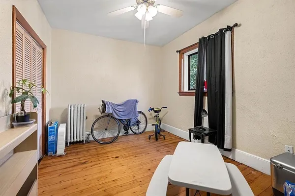 a room with furniture a rug and a window