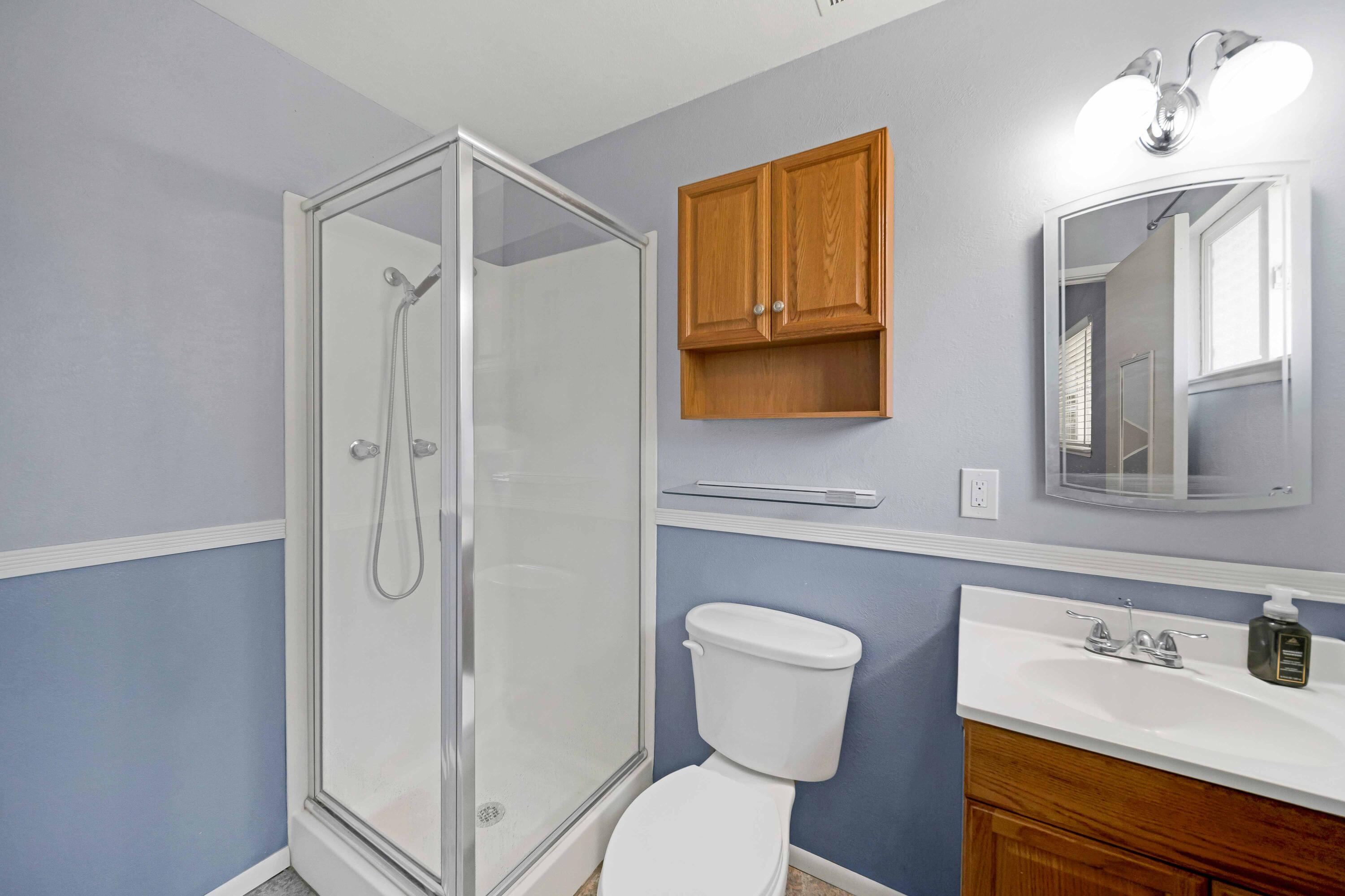 1945 Luning Street Red Bluff, CA 96080 - Photo 16 of 23 a bathroom with a sink a toilet and shower