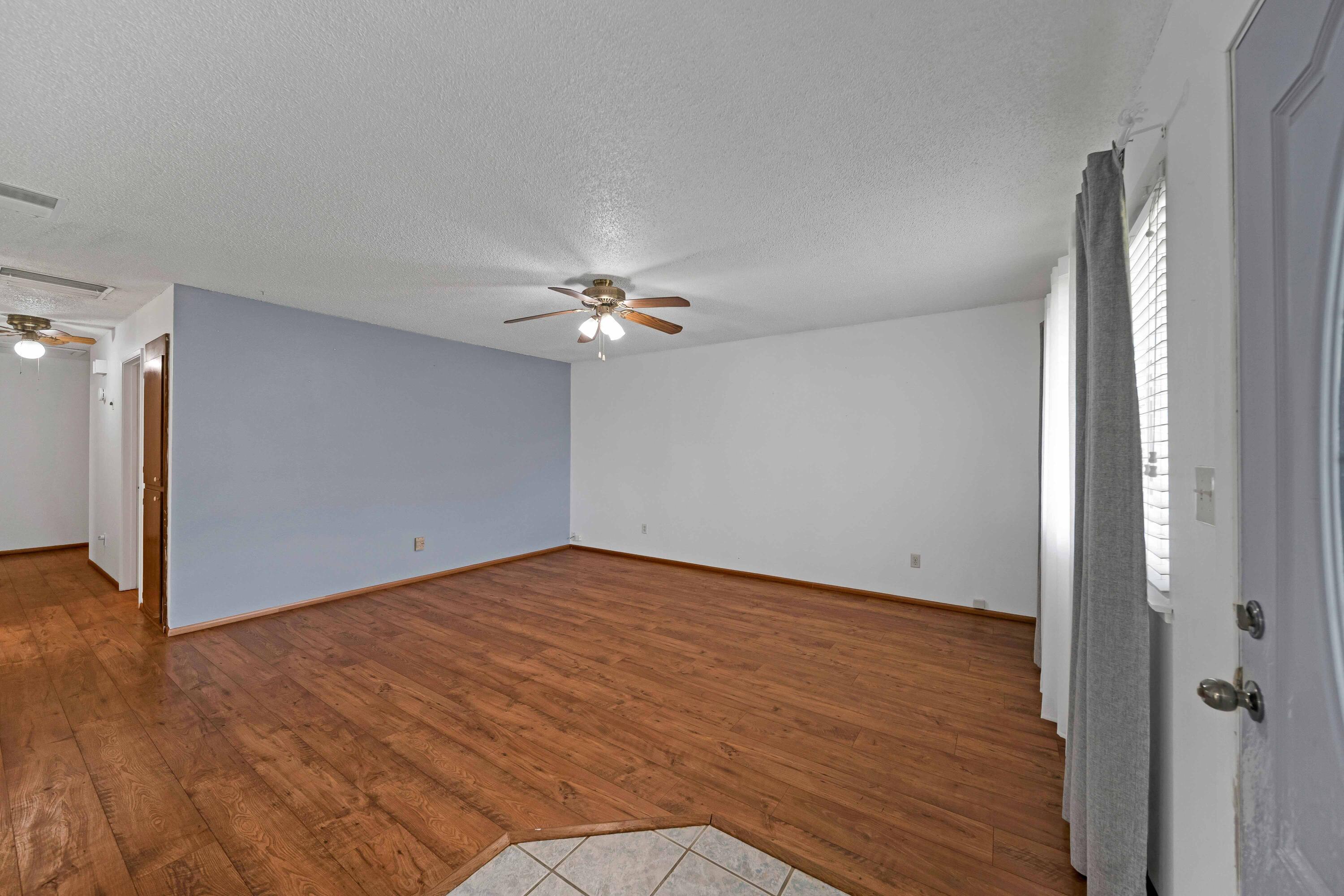 1945 Luning Street Red Bluff, CA 96080 - Photo 2 of 23 a view of an empty room with wooden floor