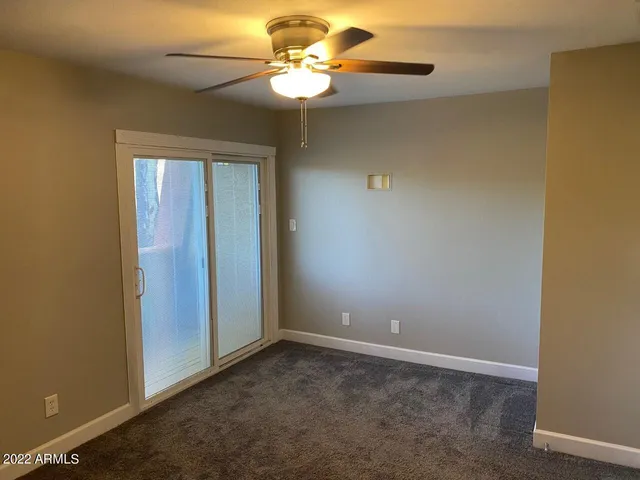 a view of a chandelier fan in a room