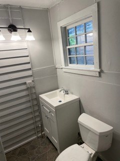 1429 25th Street Columbus, GA 31901 - Photo 12 of 17 a bathroom with a sink toilet and window