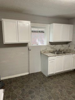 1429 25th Street Columbus, GA 31901 - Photo 14 of 17 a view of kitchen with granite countertop white cabinets and a stove