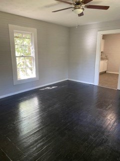 1429 25th Street Columbus, GA 31901 - Photo 5 of 17 an empty room with wooden floor and windows