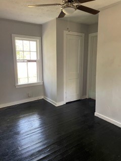 1429 25th Street Columbus, GA 31901 - Photo 7 of 17 an empty room with wooden floor and windows
