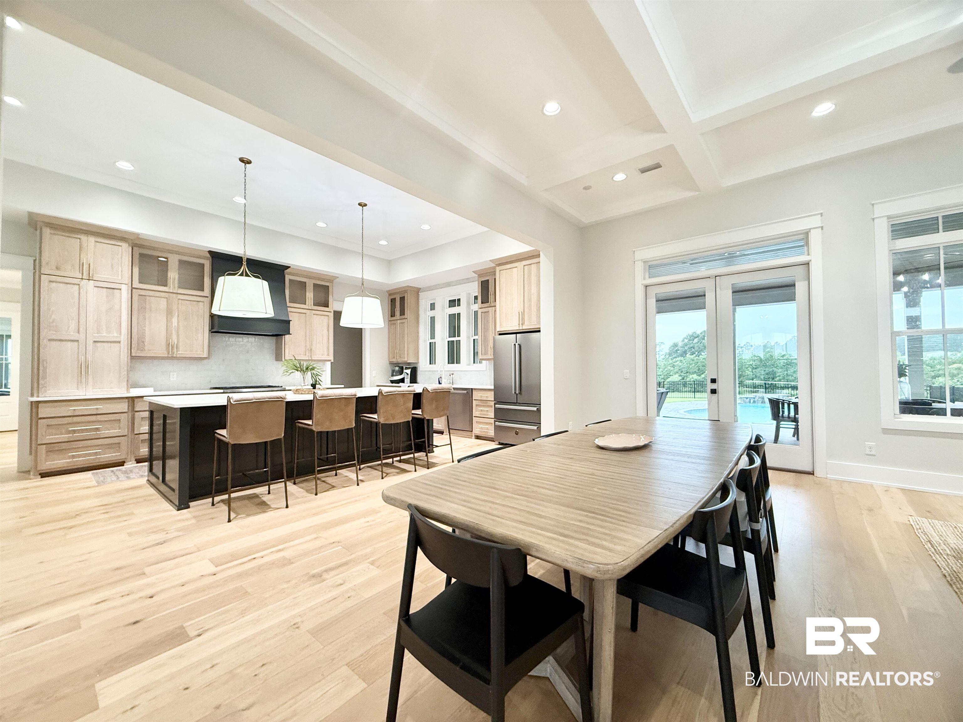 21767 Gallery Boulevard Fairhope, AL 36532 - Photo 9 of 74 Dining space featuring recessed lighting, french doors, light wood finished floors, beamed ceiling, and coffered ceiling