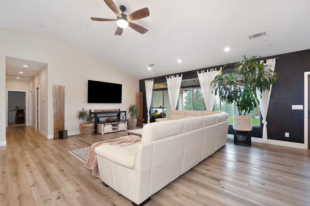 3960 Fort Jim Road Placerville, CA 95667 - Photo 12 of 64 a living room with furniture and a flat screen tv