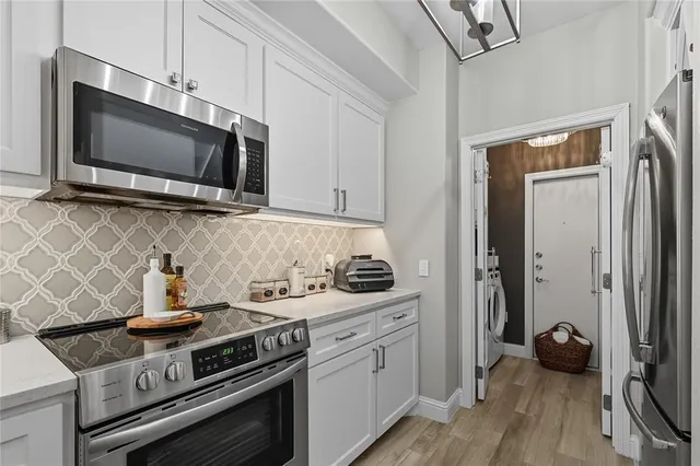 a kitchen with a stove and a microwave