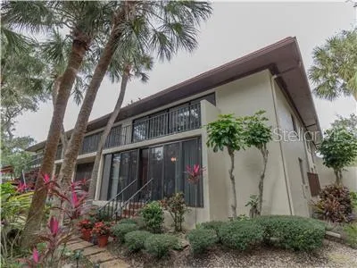 a front view of house and yard with green space