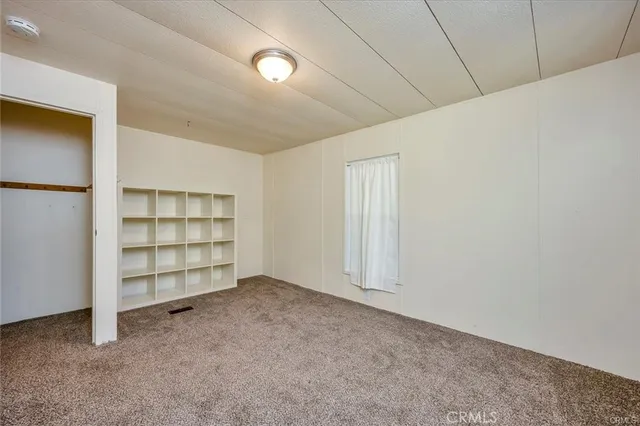 an empty room with a empty space and a window