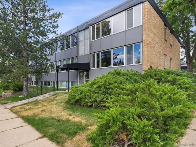 a backyard of a house with plants and trees