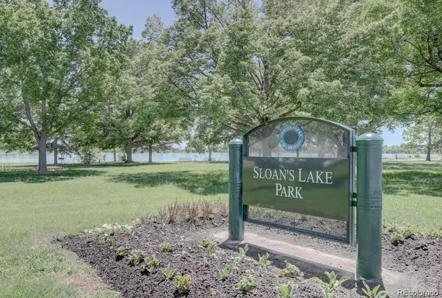 a view of a street with large trees