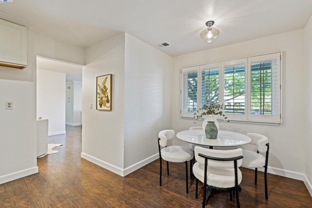 a work room with furniture and windows