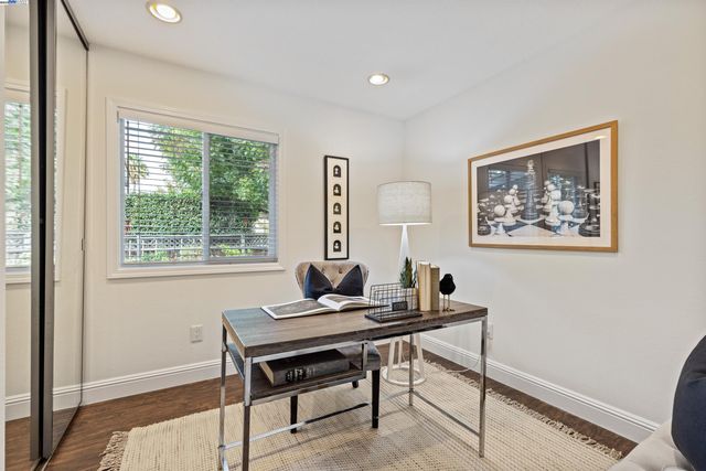 a bedroom with a bed and a table with chair