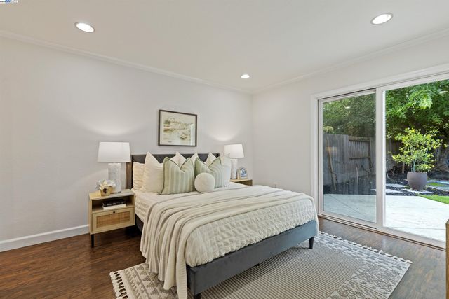 a spacious bedroom with a bed and a couch