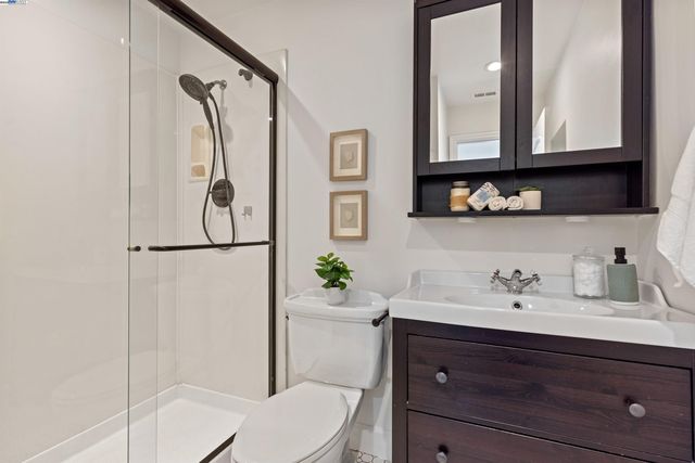 a view of a chair and table in backyard