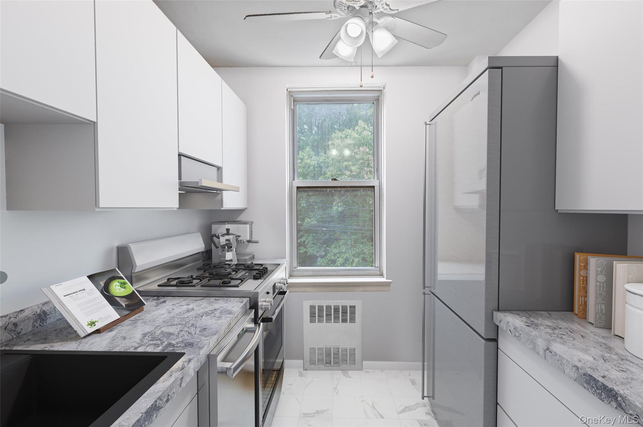 4320 Van Cortlandt Park East, Unit 4C Bronx, NY 10470 - Photo 12 of 21 a kitchen with stainless steel appliances granite countertop a sink stove and refrigerator
