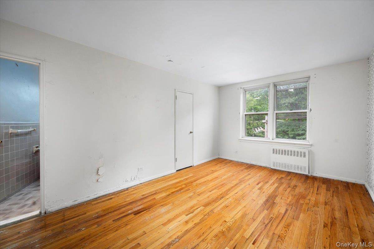 4320 Van Cortlandt Park East, Unit 4C Bronx, NY 10470 - Photo 13 of 21 a view of empty room with wooden floor and fan