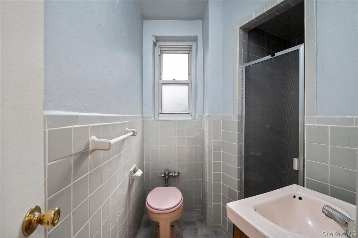 4320 Van Cortlandt Park East, Unit 4C Bronx, NY 10470 - Photo 16 of 21 a bathroom with a sink toilet and shower