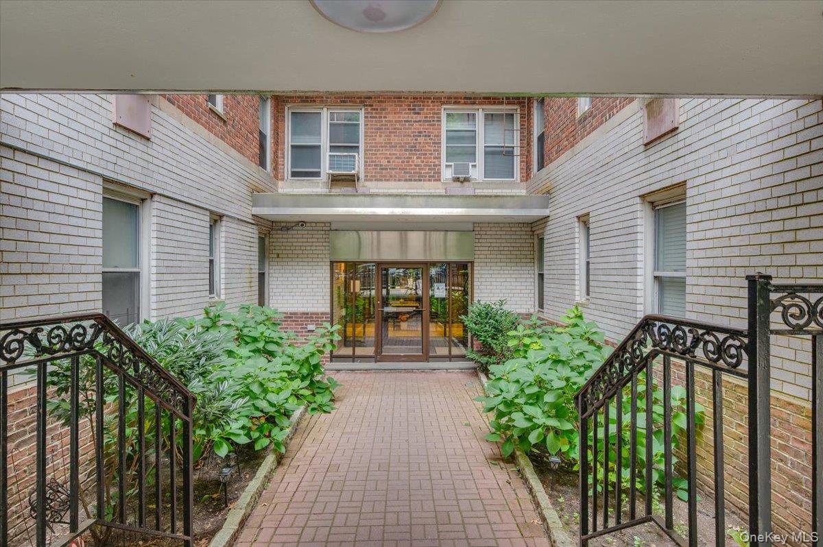 4320 Van Cortlandt Park East, Unit 4C Bronx, NY 10470 - Photo 2 of 21 a front view of a house with garden