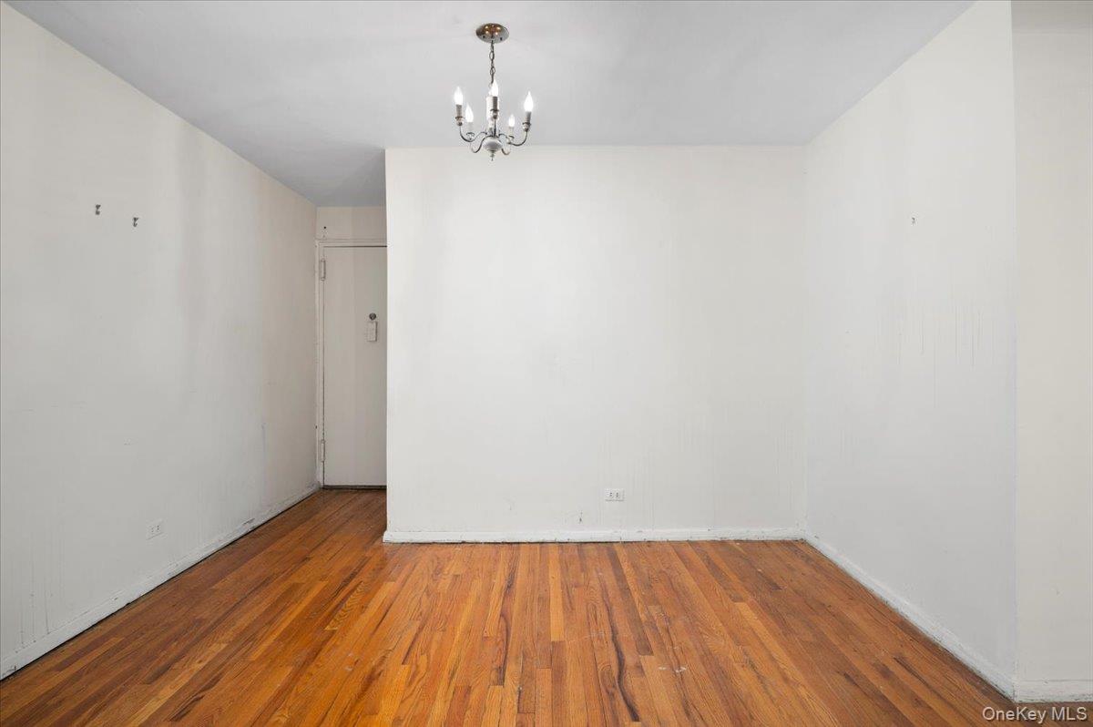 4320 Van Cortlandt Park East, Unit 4C Bronx, NY 10470 - Photo 3 of 21 a view of a room with wooden floor and bench