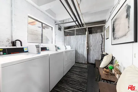 a view of livingroom with furniture and a potted plant