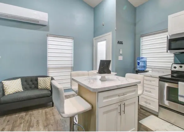 a bedroom with bed and a window