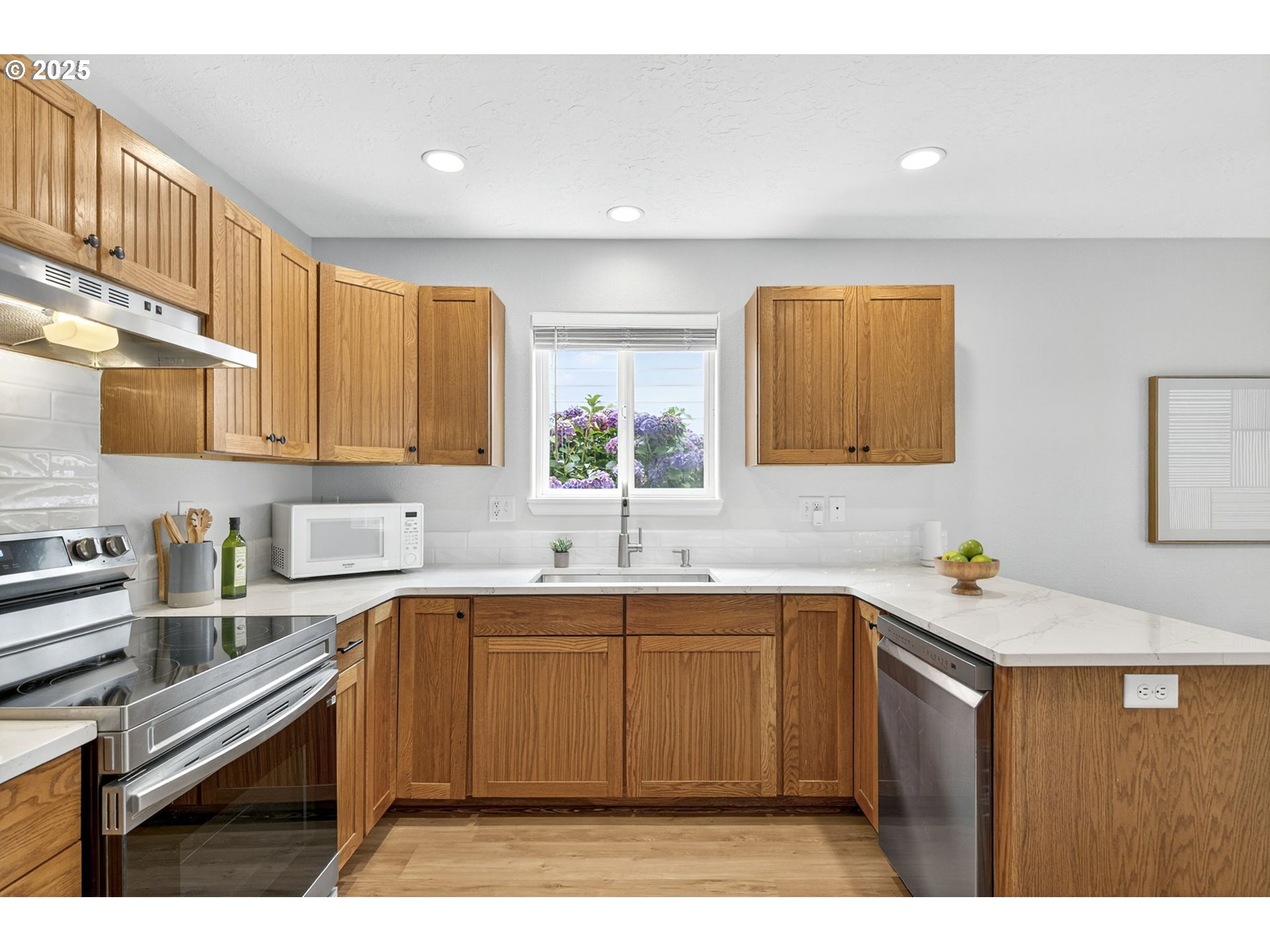 929 Northwest Spring Street Newport, OR 97365 - Photo 11 of 46 a kitchen with a sink a window and cabinets