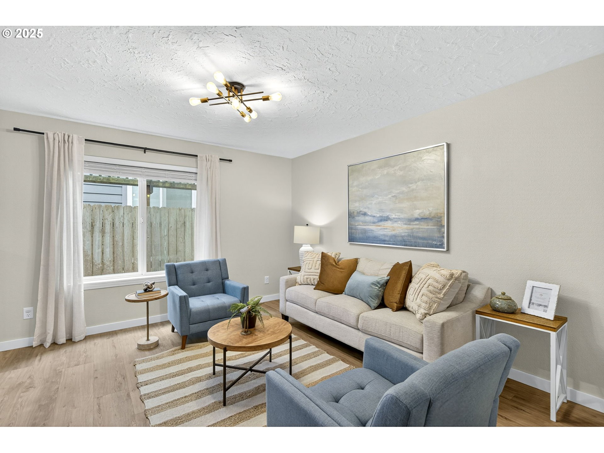929 Northwest Spring Street Newport, OR 97365 - Photo 15 of 46 a living room with furniture and a large window