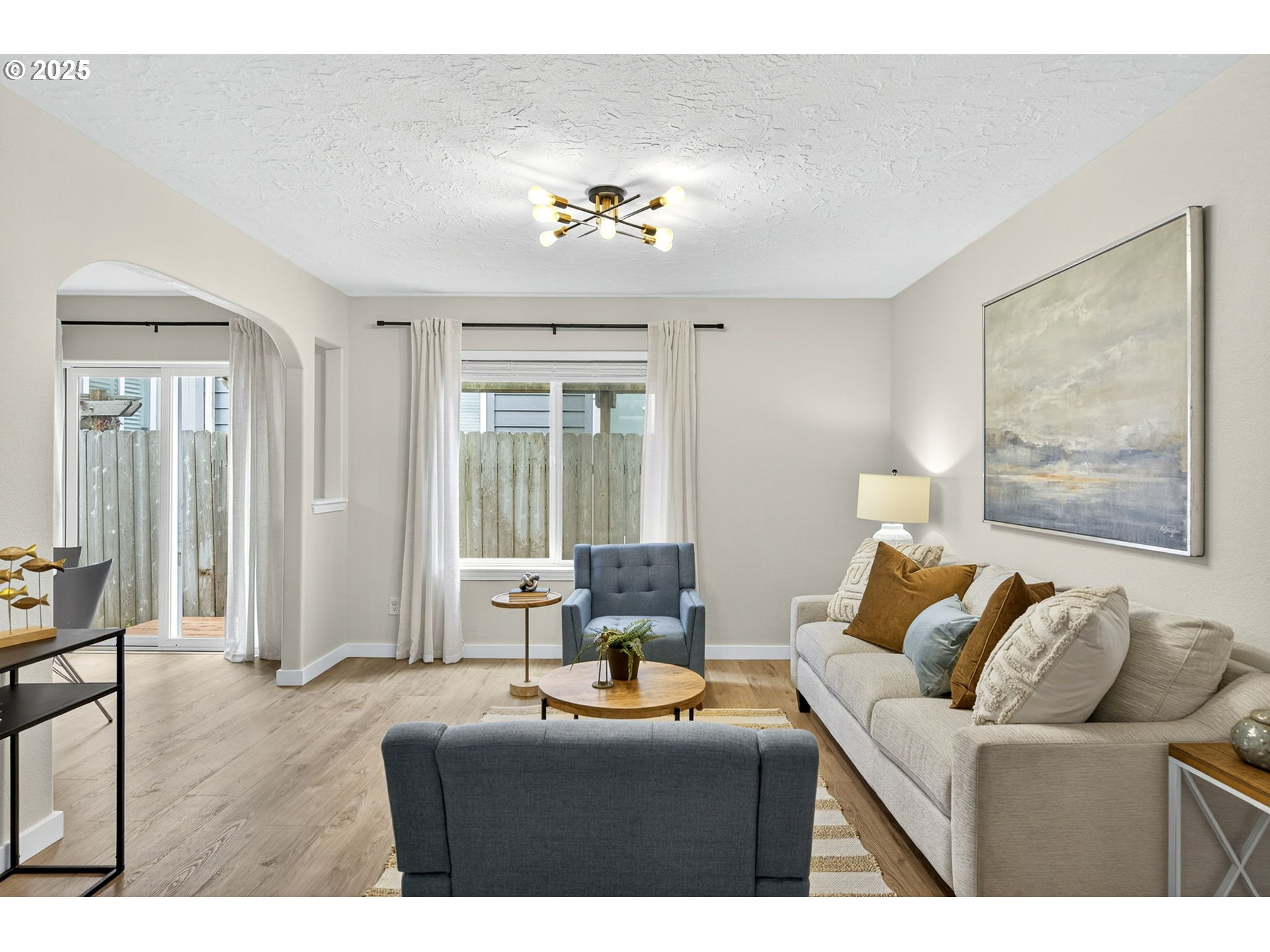 929 Northwest Spring Street Newport, OR 97365 - Photo 20 of 46 a living room with furniture and a large window