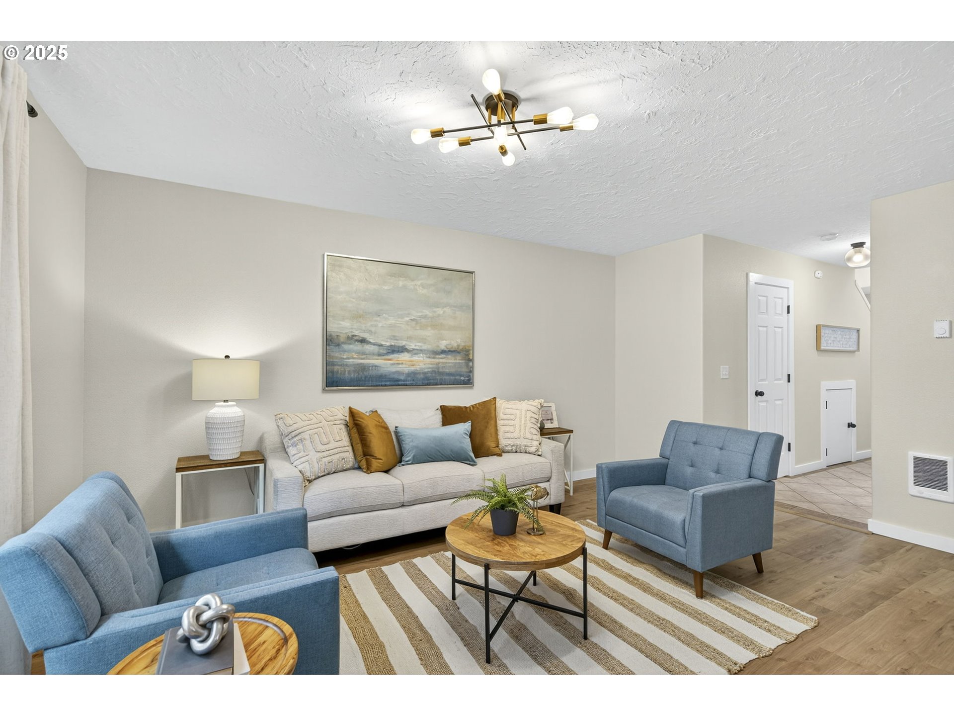 929 Northwest Spring Street Newport, OR 97365 - Photo 21 of 46 a living room with furniture and a lamp
