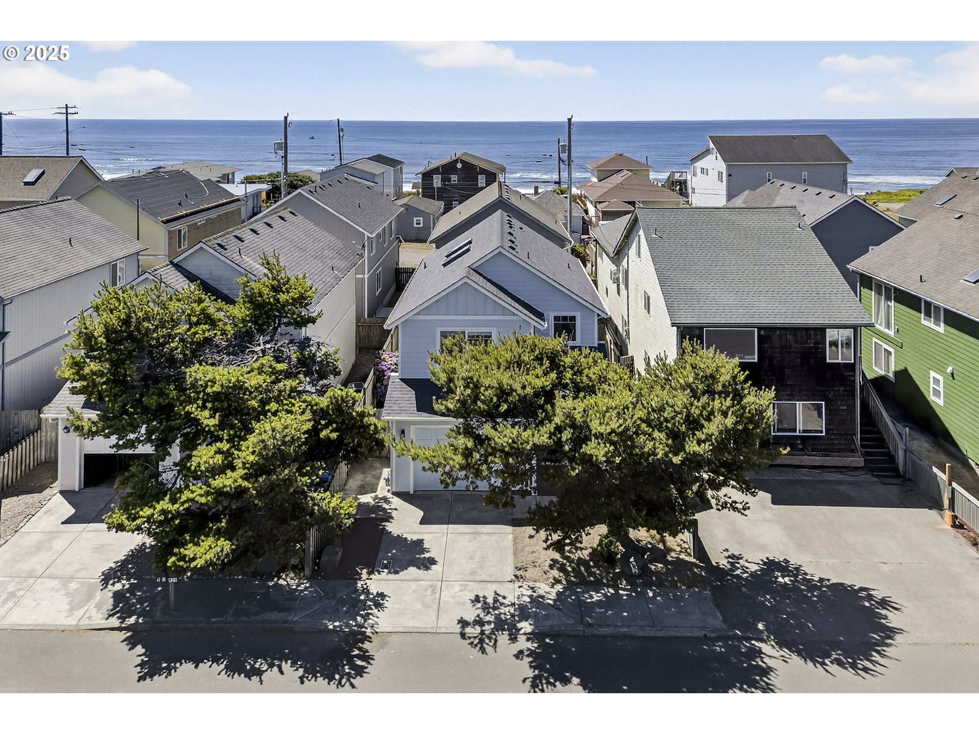 929 Northwest Spring Street Newport, OR 97365 - Photo 43 of 46 a view of a house with a yard and garden