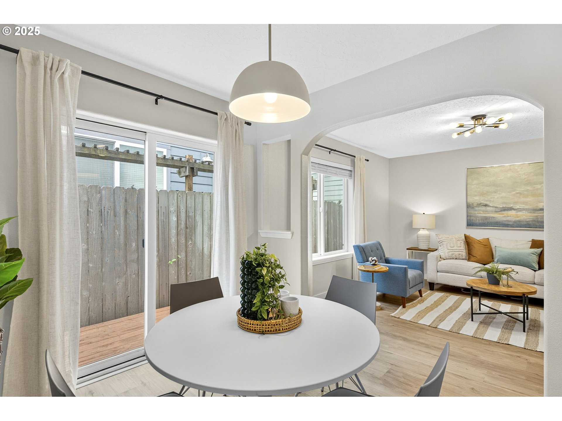 929 Northwest Spring Street Newport, OR 97365 - Photo 8 of 46 a view of a dining room with furniture and a potted plant