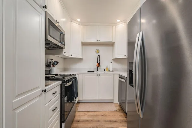 a bedroom with a bed and a desk