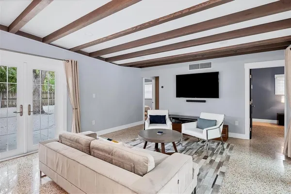 a living room with furniture and a large window