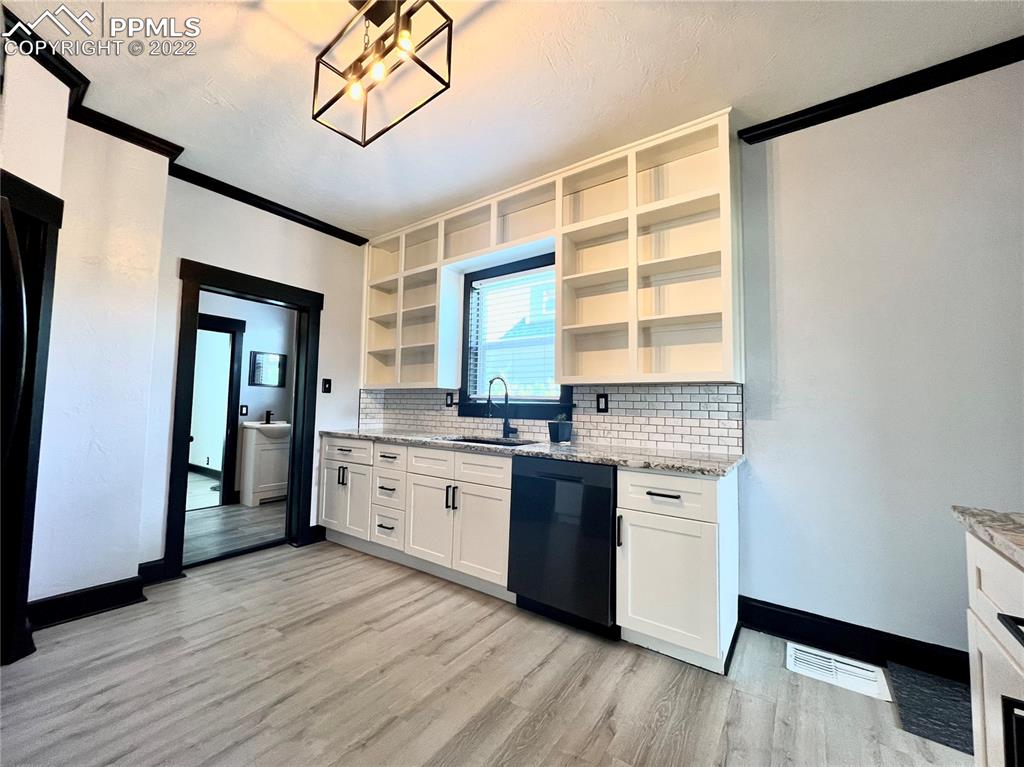 Undisclosed Address Pueblo, CO 81004 - Photo 4 of 7 a kitchen with stainless steel appliances granite countertop a stove and a refrigerator