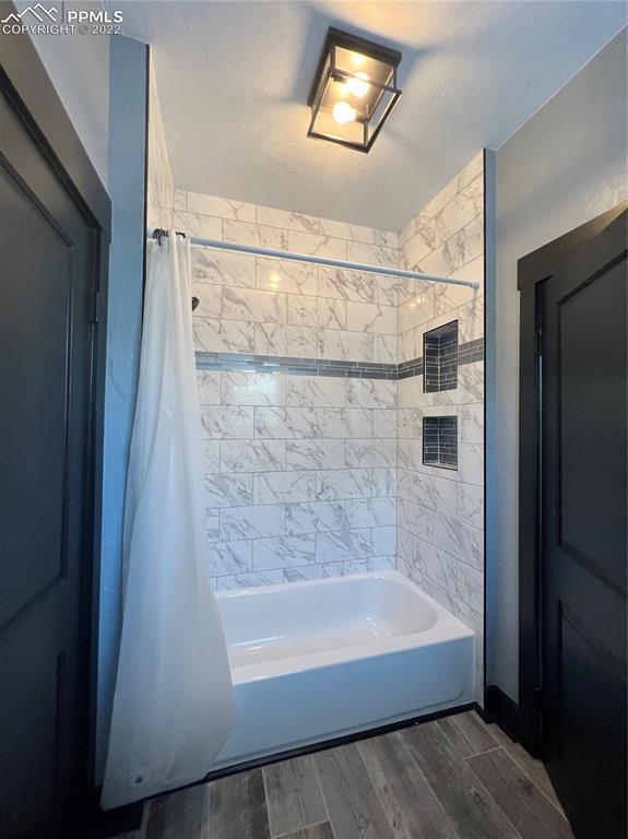 Undisclosed Address Pueblo, CO 81004 - Photo 7 of 7 a bathroom with a bathtub and shower