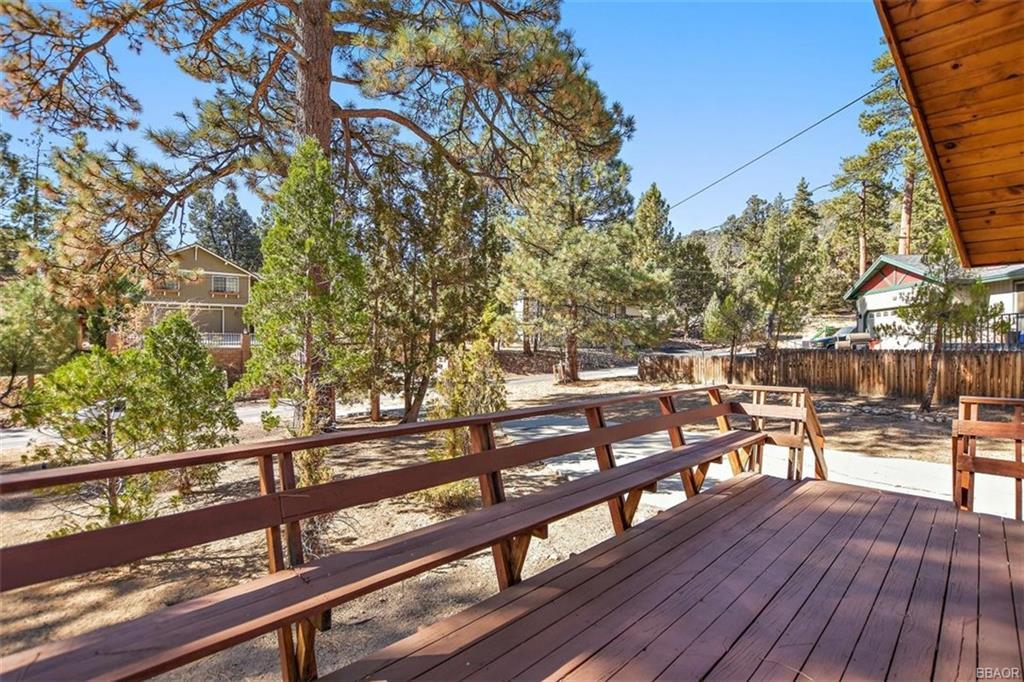1082 Snow Ridge Road Big Bear City, CA 92314 - Photo 3 of 27 a view of a balcony with wooden floor and seating space