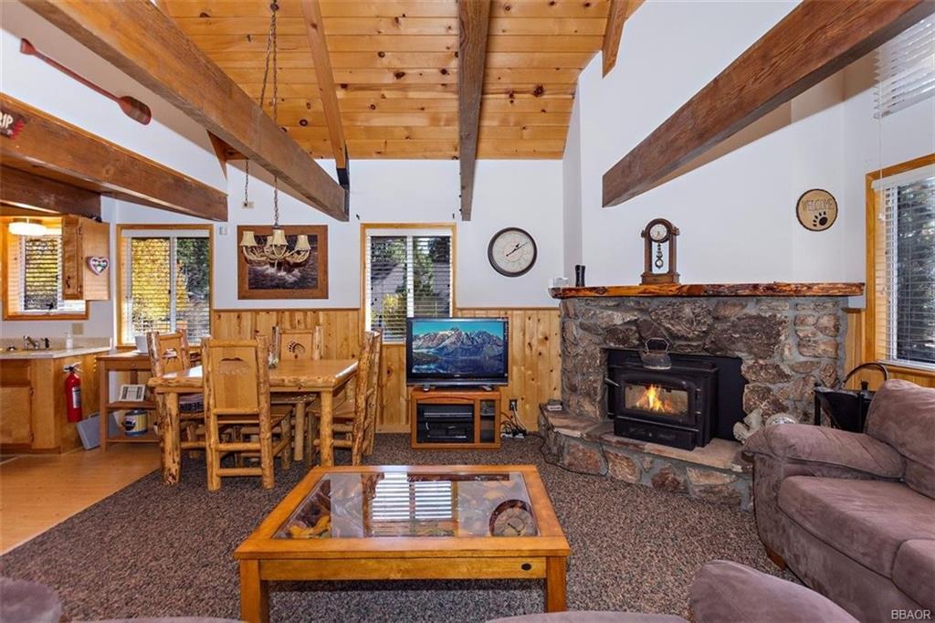 1082 Snow Ridge Road Big Bear City, CA 92314 - Photo 5 of 27 a living room with furniture and a fireplace
