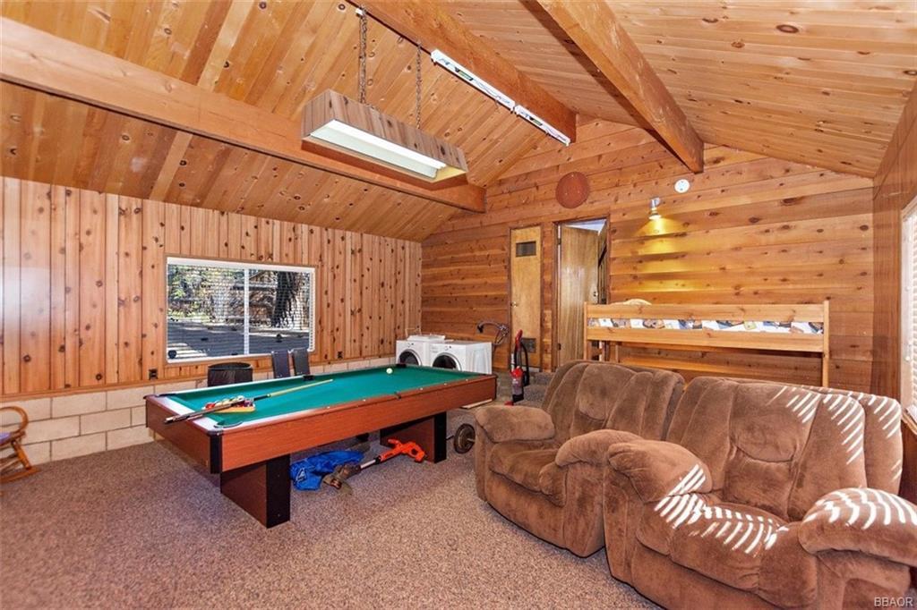 1082 Snow Ridge Road Big Bear City, CA 92314 - Photo 8 of 27 a outdoor living room with furniture and a fireplace