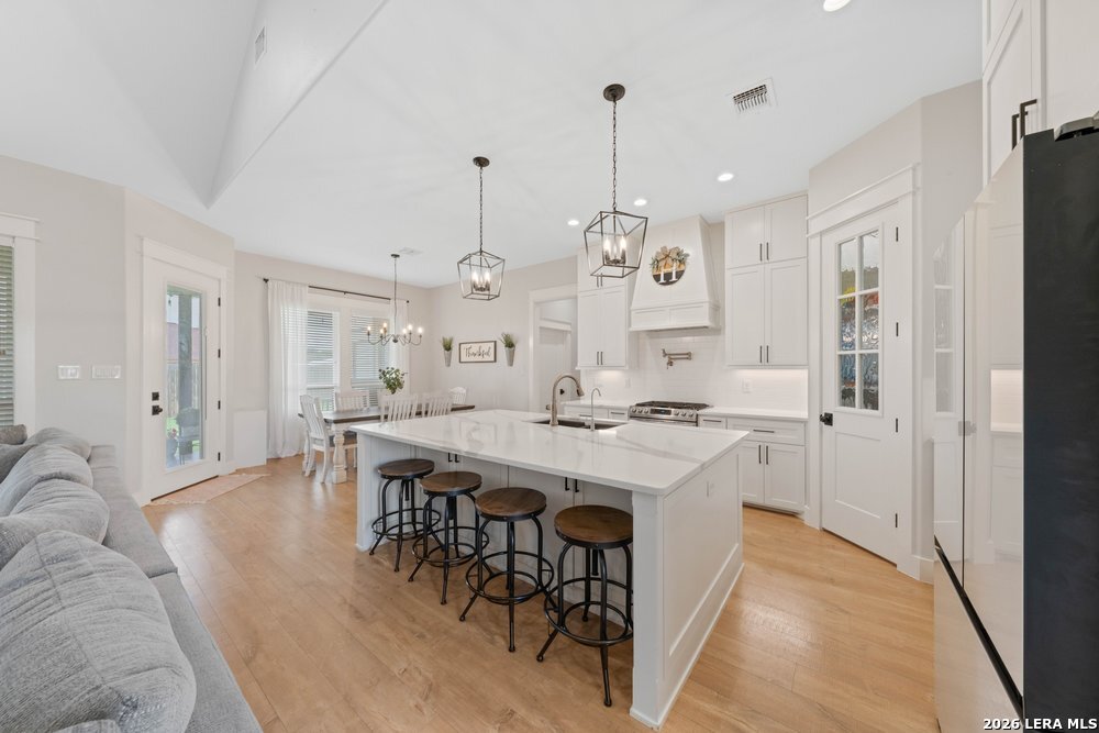 116 Park Heights Poth, TX 78147 - Photo 12 of 48 a large kitchen with a table and chairs