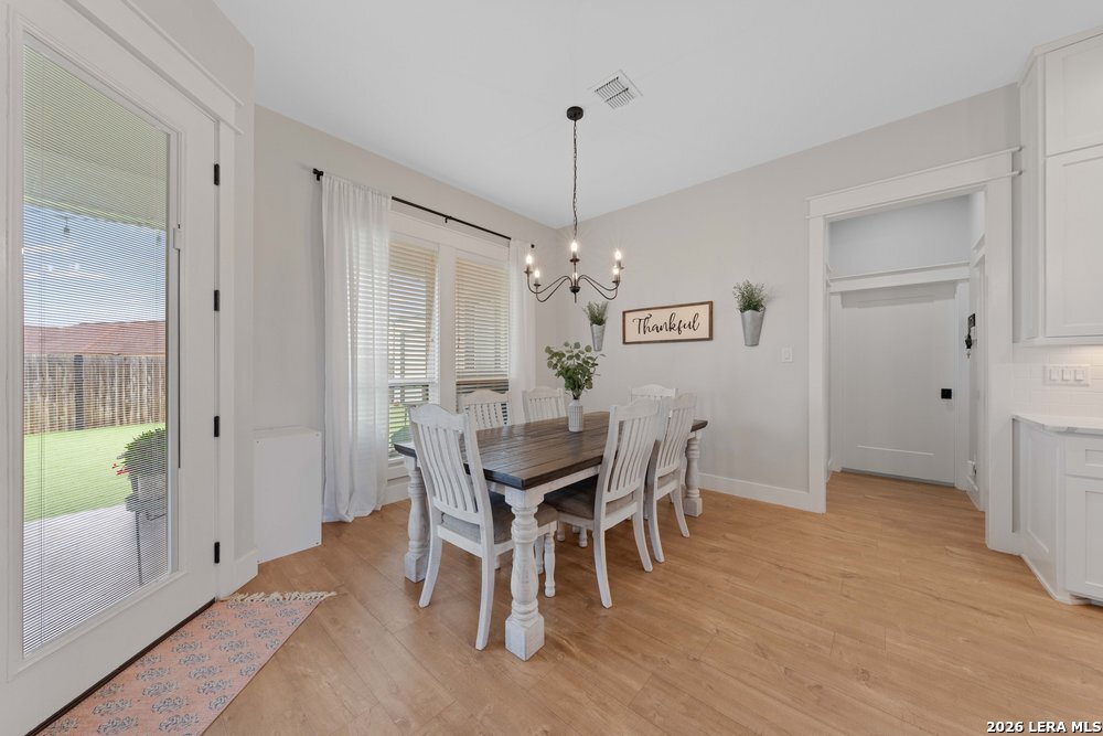 116 Park Heights Poth, TX 78147 - Photo 15 of 48 a view of a dining room with furniture window and wooden floor