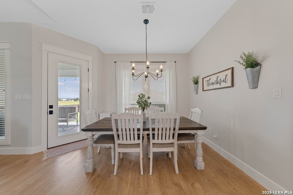 116 Park Heights Poth, TX 78147 - Photo 16 of 48 a view of a dining room with furniture window and wooden floor