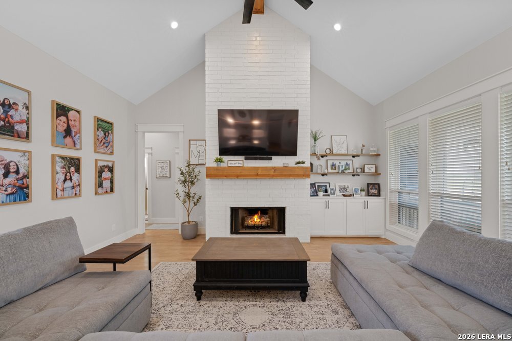 116 Park Heights Poth, TX 78147 - Photo 20 of 48 a living room with furniture flat screen tv and a fireplace