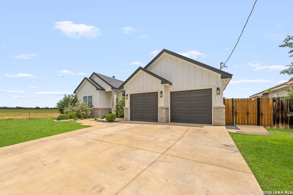 116 Park Heights Poth, TX 78147 - Photo 3 of 48 a view of a house with a yard and garage