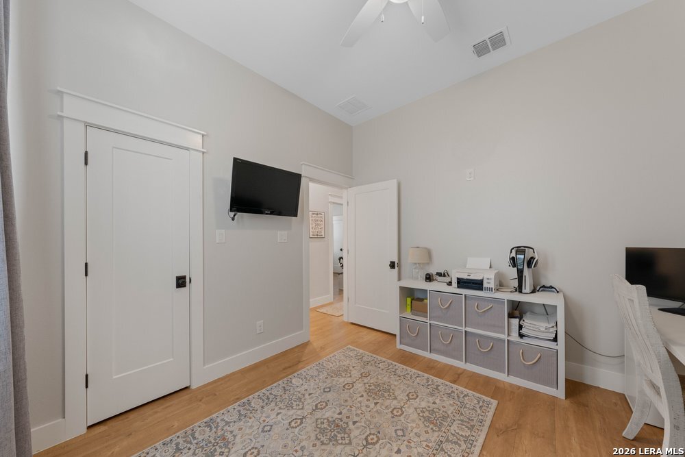 116 Park Heights Poth, TX 78147 - Photo 37 of 48 a view of a workspace with furniture and wooden floor